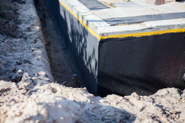 Professional Waterproofing technician working in Bridgeport, WA